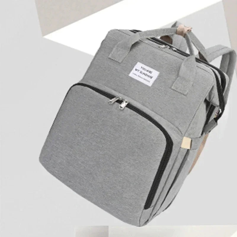 Sac à dos à langer pliable avec lit bébé intégré et poches isothermes – Grande capacité