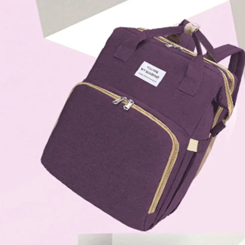 Sac à dos à langer pliable avec lit bébé intégré et poches isothermes – Grande capacité
