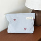 Pochette bébé rayée bleue avec nœud brodé rangement couches et accessoires