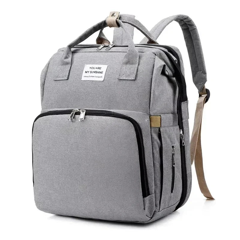Sac à dos à langer pliable avec lit bébé intégré et poches isothermes – Grande capacité