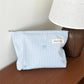 Pochette bébé rayée bleue avec nœud brodé rangement couches et accessoires